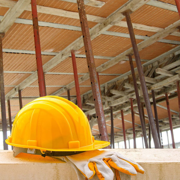 yellow hard hat on construction site